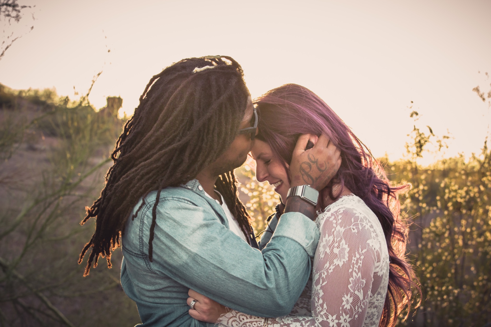 Couple sharing a quiet moment outdoors at sunset
